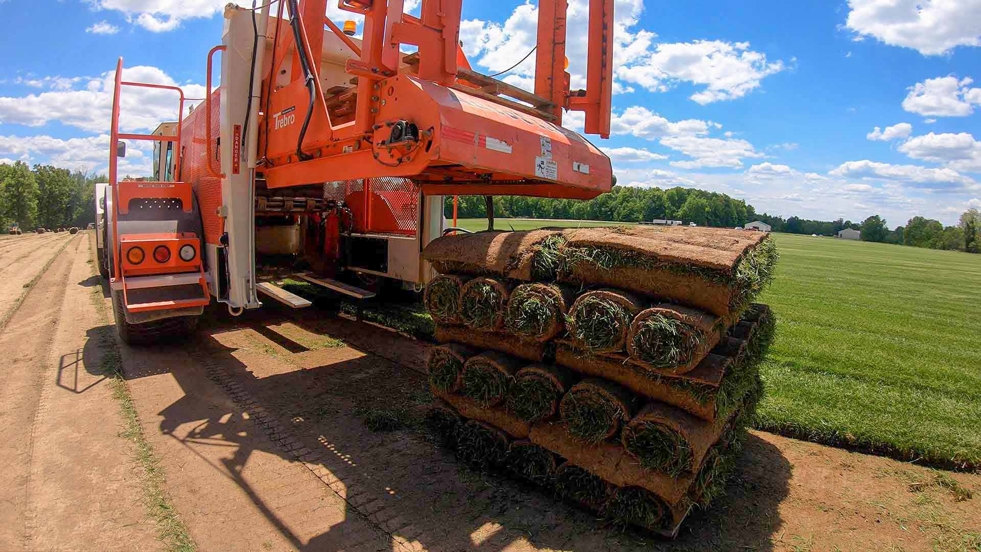 pallets of sod being cut